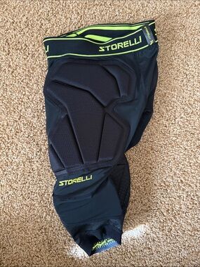 Storelli Black Protective Compression Shorts with Neon Yellow Accent.  Soccer